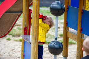 Child playing on climbing frame