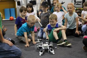 Children looking at robot