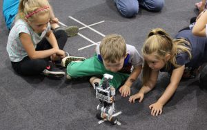 Children looking at robot