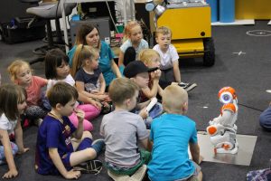 Children looking at robot