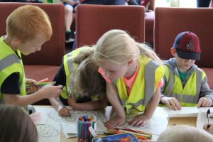Children colouring pictures of brains