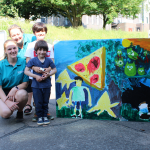 Boys presenting painting