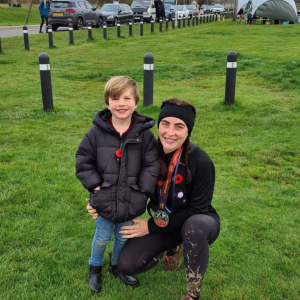 Emma and child smiling to camera