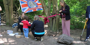Children adding items to time capsule