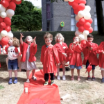 Children throwing their graduation caps