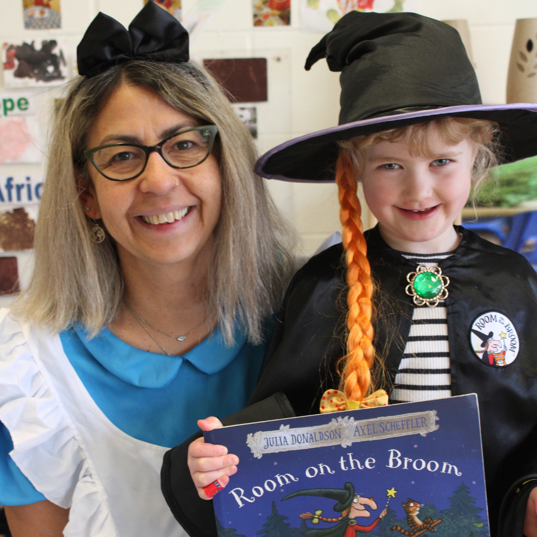 Staff and child dressed up for World Book Day