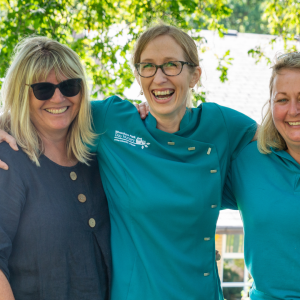 Teresa with members of staff at 2022 graduation