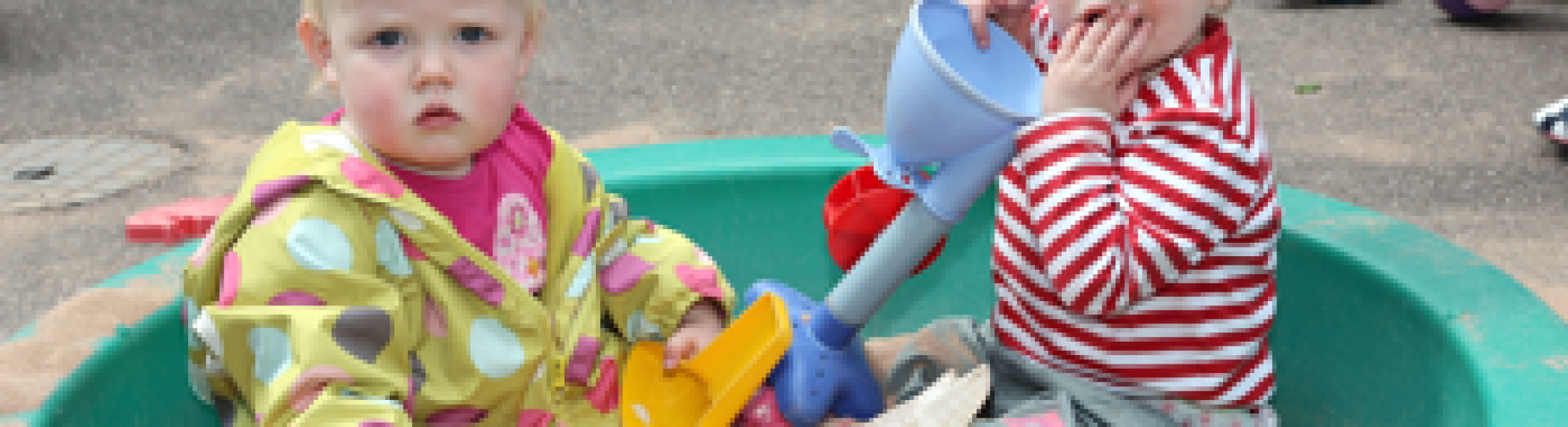 Two children in sandbox Wivenhoe Park Day Nursery